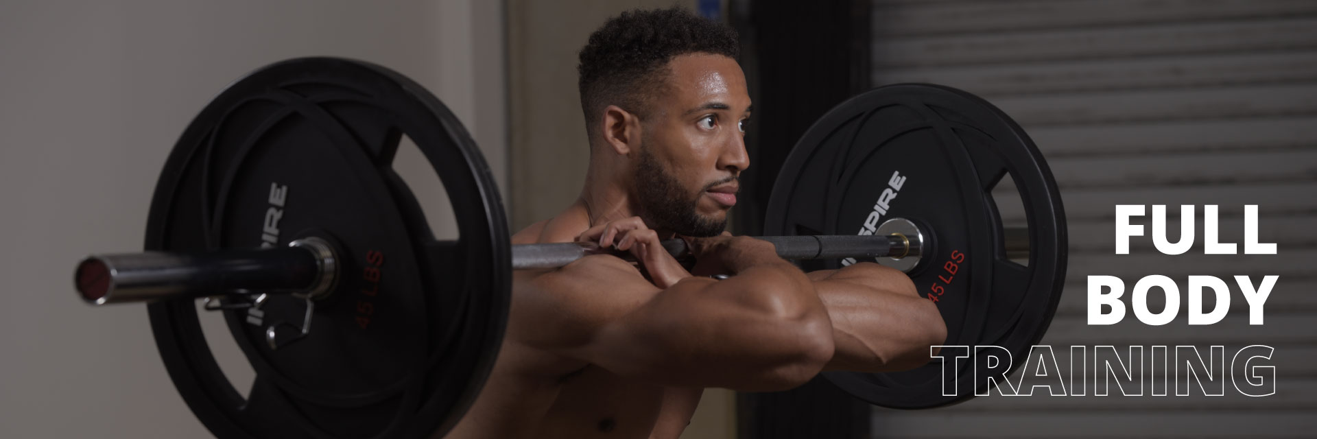 ChromeBarBanner Man squatting with the 7 foot chrome olympic bar and weights from Inspire Fitness for full body training